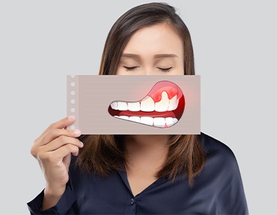 woman holding an illustration of symptoms in front of her face